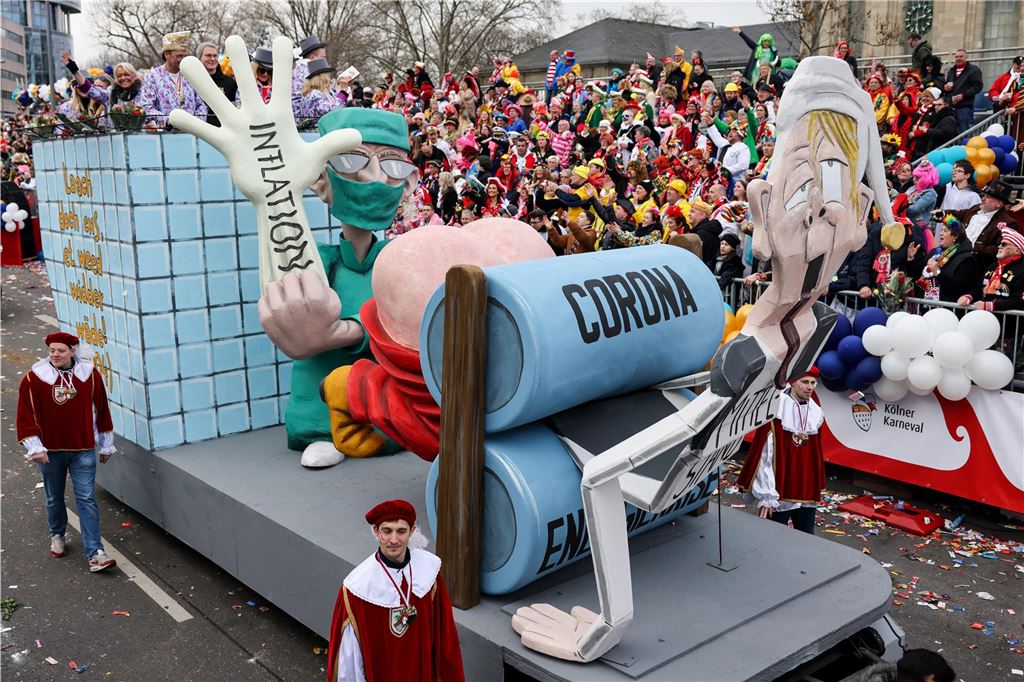 Karneval 2024 in NRW: Die wichtigsten Termine im Überblick Der Karnevalsumzug präsentiert einen Mottowagen, der die Coronakrise und die Inflation karikiert.